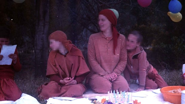 An undated image of Shishy (centre), the partner of Swami Akhandananda Saraswati, at a retreat, now known as the Mangrove Yoga Ashram, in the foothills of Mangrove mountain in NSW in the 1980s. A royal commission is examining how the retreat handled sex abuse complaints against Swami Akhandananda Saraswati who ran the NSW Central Coast compound from 1974 to 1986. (AAP)