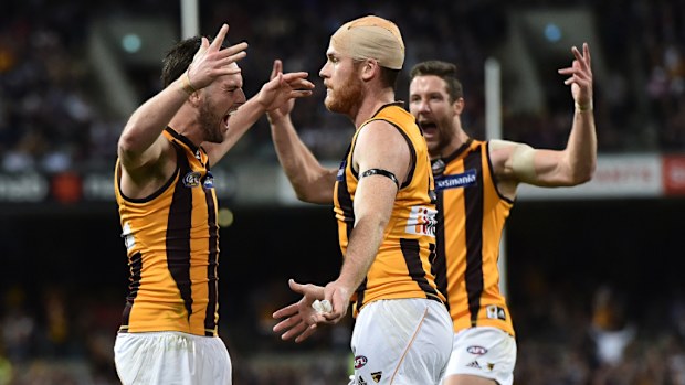 Hawthorn Hawks players celebrate Matthew Suckling’s goal. (AAP)