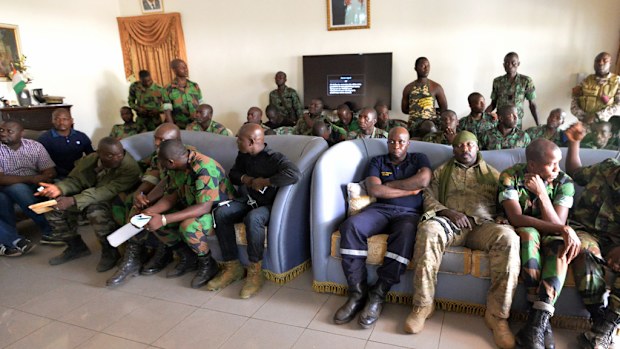 A delegation of mutineer soldiers wait at the deputy prefect's residence in Bouake, Ivory Coast, on January 7, 2017, for talks with the Defence Minister one day after soldiers rose up and seized control of Ivory Coast's second city. (AFP)
