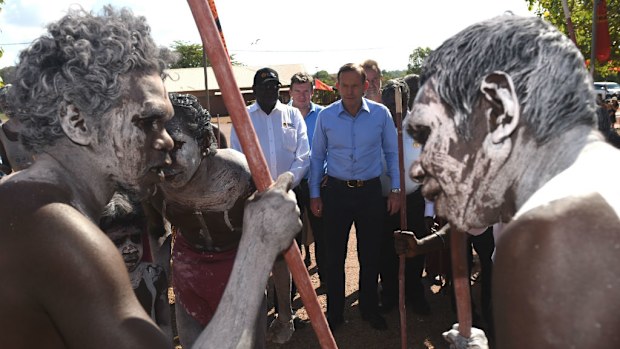 Australian Prime Minister Tony Abbott is greeted with a traditional Welcome to Country ceremony on his arrival at Yirrkala on the Gove Peninsula in North East Arnhem Land, Northern Territory. (AAP)