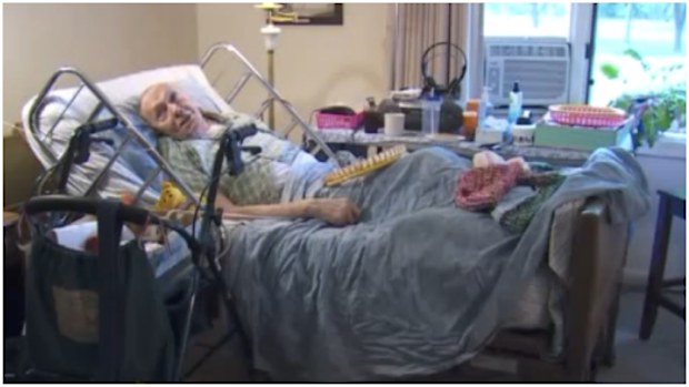 Morrie Boogart knits hats from his bed in a Michigan hospice. (FOX 17)