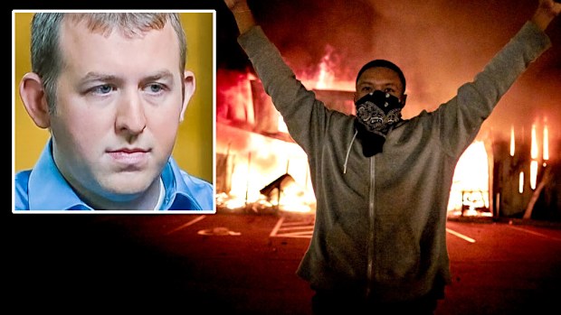 A protestor in Ferguson, Missouri, and (inset) officer Darren Wilson.
