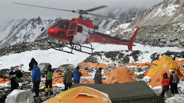 A helicopter prepares to land at the Mount Everest base camp. (Getty)