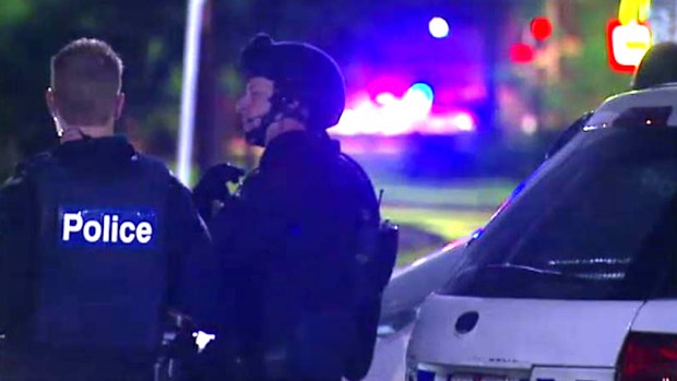 Police outside a home where a man was alleged to be armed. (9NEWS)
