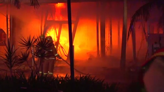 Crews have contained the blaze to five stores. (Twitter)