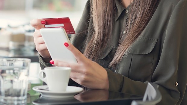 Woman paying with bank card