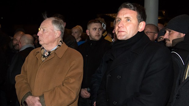 Alexander Gauland (L) of the anti-immigration party Alternative for Germany (AfD) and parliamentary party leader of the AFD in Thuringia, Bjoern Hoecke (R) attend a vigil in Berlin, two days after an attack at the Christmas market in central Berlin, on December 21, 2016. (AFP)