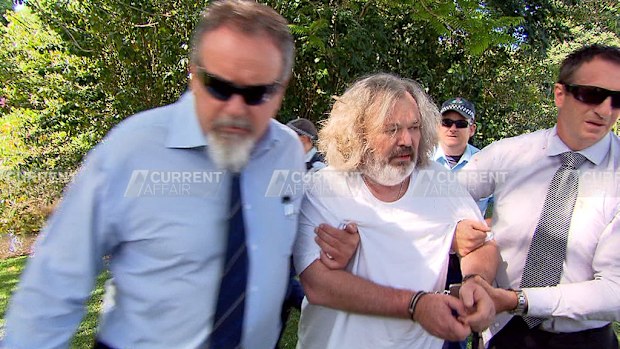 Foster being arrested yesterday near Byron Bay. (A Current Affair)