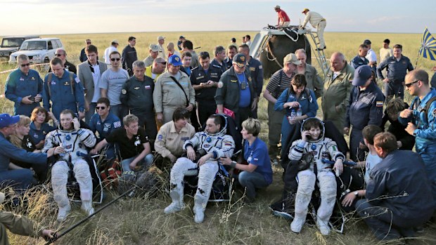 ISS crew of Russian cosmonaut Anton Shkaplerov (C), US astronaut Terry Virts (L), and Italian astronaut Samantha Cristoforetti. (AAP/EPA)