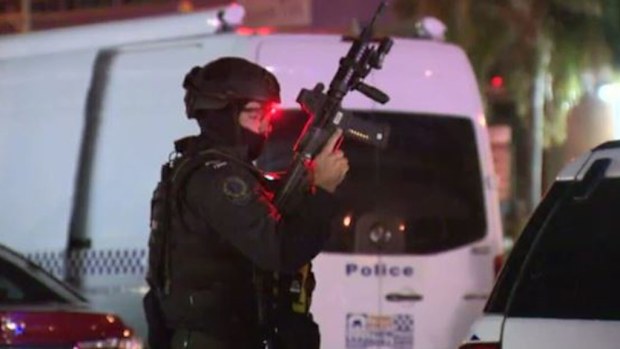 Police have surrounded the building and are negotiating with the suspect. (9NEWS)
