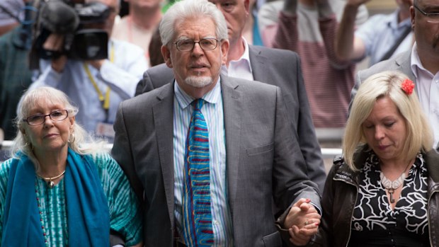 Rolf Harris leaves Southwark Crown Court, with his wife Alwen and daughter Bindi in 2014. (AAP)