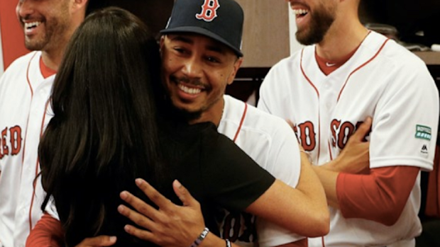 Meghan meets cousin at the baseball