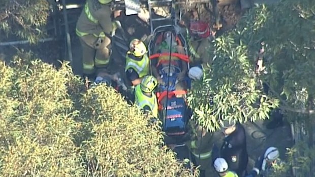 Firefighters managed to free to man about 9.30am. (9NEWS)