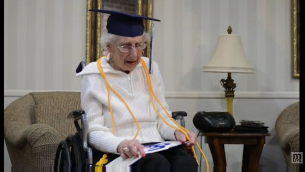 Margaret Thome Bekema broke down in tears as she was handed her graduation sash. (MLive)