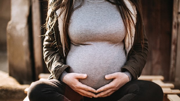 The woman reported contractions early in the morning.