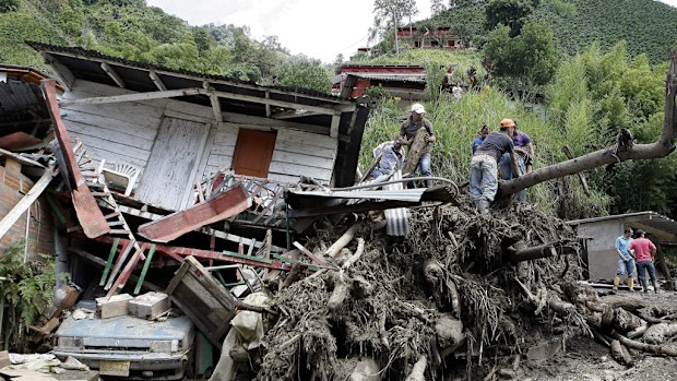 Rescue workers search for survivors. (AAP)