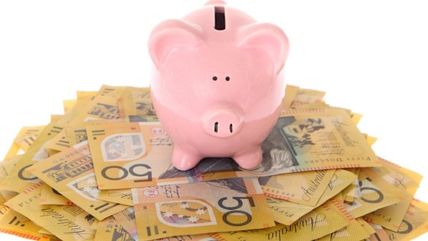 Piggy bank on AUD $50 bills