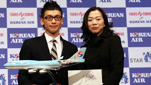 South Korean pop singer Rain (L) poses with Heather Cho, managing Vice President of Korean Air in 2007. (Getty)