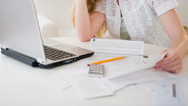 Mother paying bills