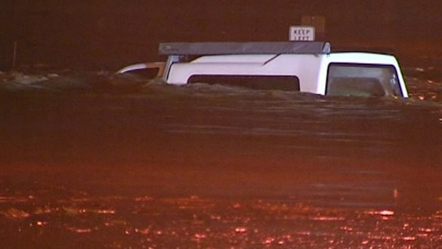 Motorists were forced to abandon their cars in the rising water. (9NEWS)
