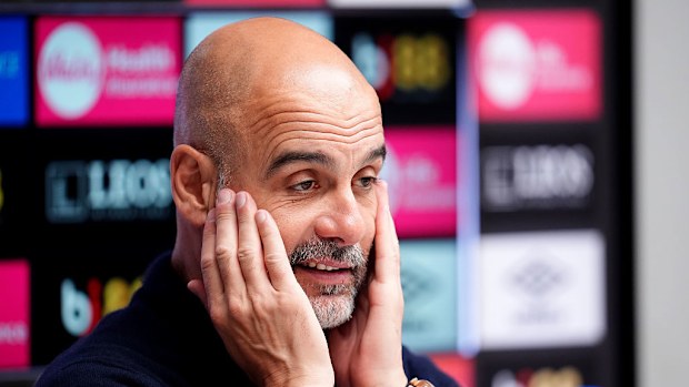 Manchester City manager Pep Guardiola speaks to the media during a press conference.