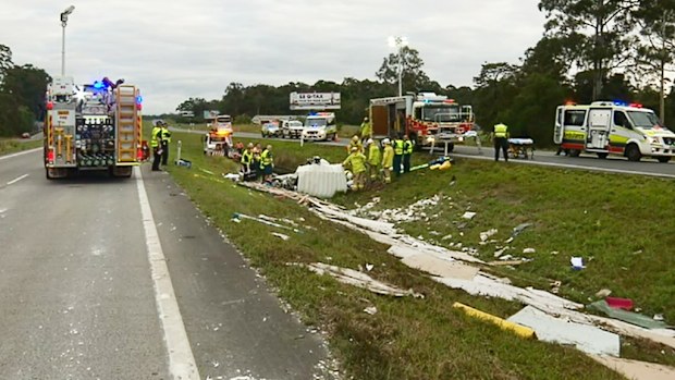 Authorities at the scene of the Palmview rollover. (9NEWS)