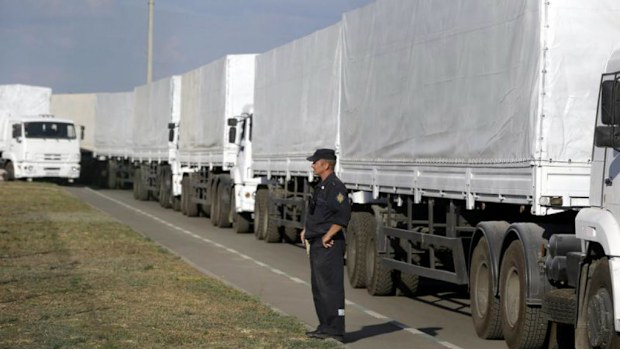 A Russian aid convoy of white trucks waits to enter Ukraine at a border control point with Ukraine in the Russian town of Donetsk, Rostov region. Picture: AP