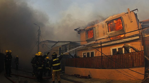 At least one person has been hurt in the blaze, and fives homes have been destroyed. (AAP)
