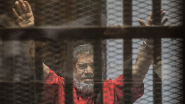  Ousted Egyptian President Mohamed Morsi during a trial session on charges of espionage in Cairo. (AFP)