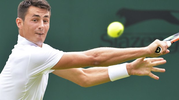 Bernard Tomic in action during his second round match at Wimbledon. (AAP)