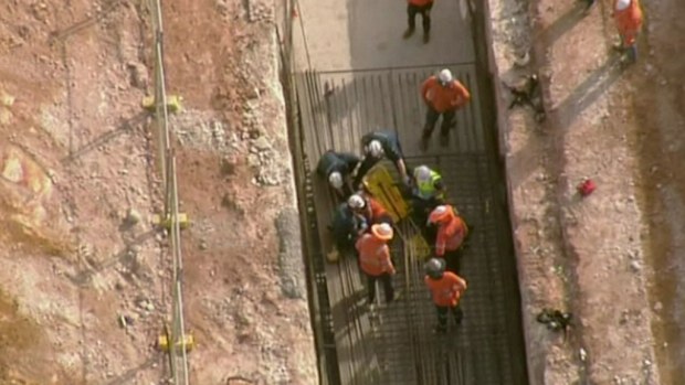 A man was working on a train line when he fell down a trench. (9NEWS)