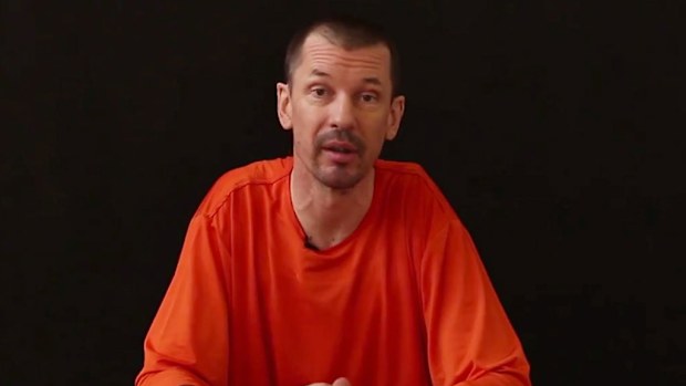 British photojournalist John Cantlie in a video filmed by ISIL militants. (AAP)