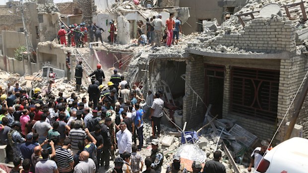 Iraqi security forces search for survivors after a bombing in the eastern neighbourhood of New Baghdad. (AAP)