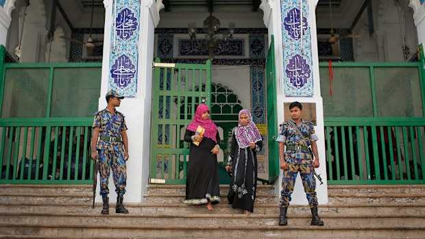 Security personnel stand guard at the entrance of a shrine, the site of an explosion, in Dhaka, Bangladesh, Saturday, Oct. 24, 2015. (AP)