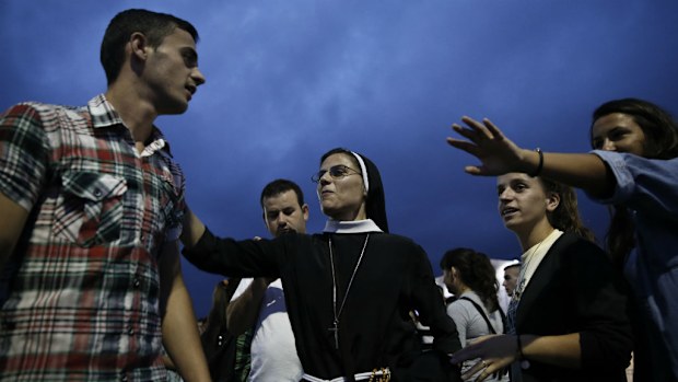 Catholic worshipers gather at Mother Teresa square ahead of Pope Francis' visit in Tirana, Albania. (AAP)