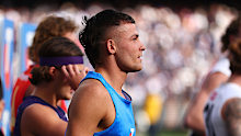 Harry Garside warms up for the half time sprint.