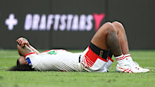 Moses Suli lays on the field. 