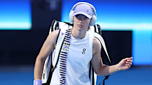 Iga Swiatek of Poland enters the court.