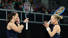 Harriet Dart and Jodie Anna Burrage of Great Britain celebrate winning.