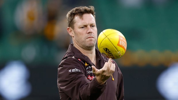 Sam Mitchell, Senior Coach of the Hawks looks on.