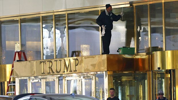 A worker cleans glass windows at Trump International Hotel, on Thursday, Jan. 2, 2025, in Las Vegas. (Bizuayehu Tesfaye/Las Vegas Review-Journal via AP)