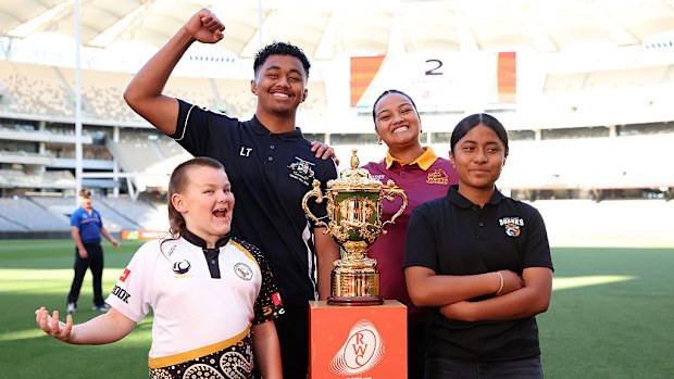 Junior players pose with the Webb Ellis Cup during a preview event in Perth.