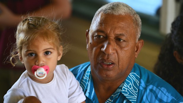 Fiji military strongman Voreque Bainimarama with his granddaughter. (Getty)