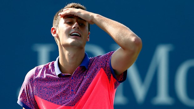 Bernard Tomic withdrew from the 2014 US Open after suffering a hip injury. (Julian Finney/Getty Images)