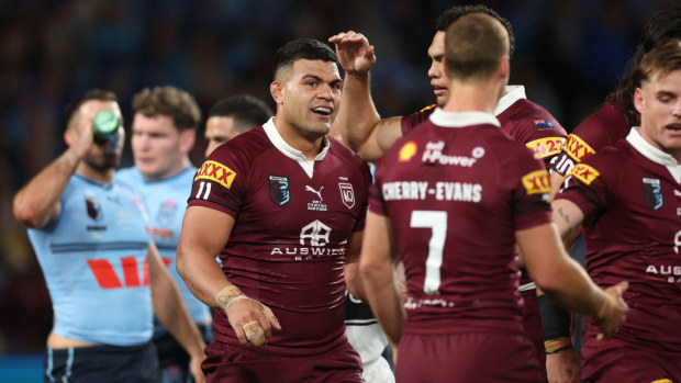 David Fifita celebrates with team mates after scoring a try.