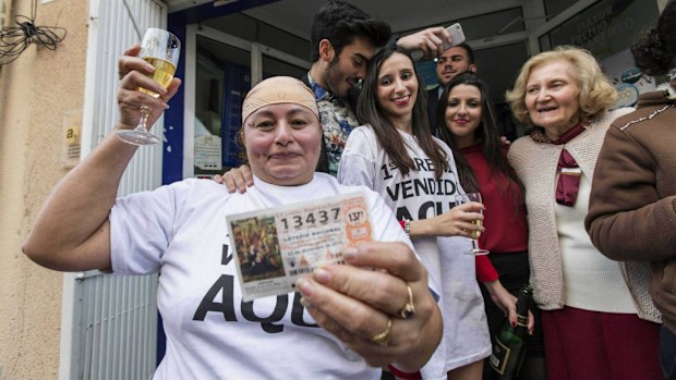 Ecuadorian Margarita Cedeno Buste, celebrates after winning the first prize of the Christmas Lottery 'El Gordo' with the number 13437. (AAP)