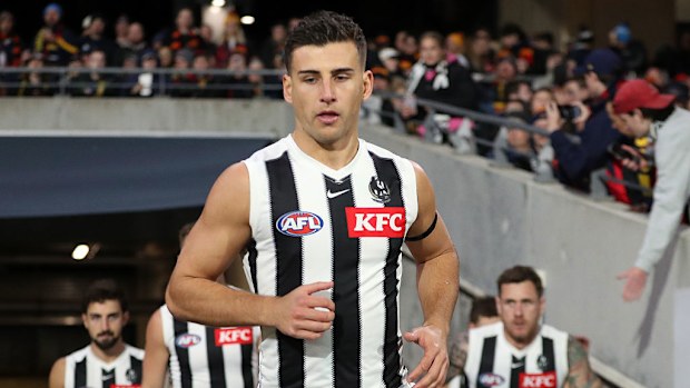 Nick Daicos of the Magpies runs out.