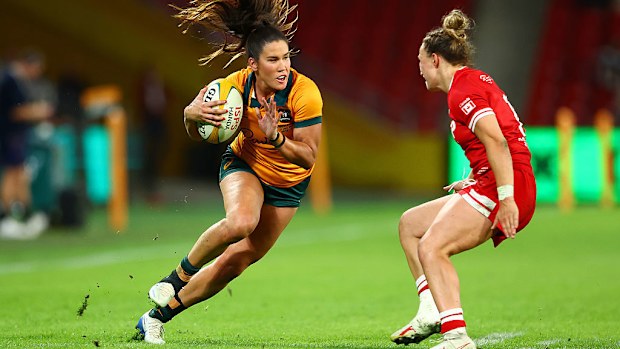 Charlotte Caslick of the Wallaroos runs with the ball.