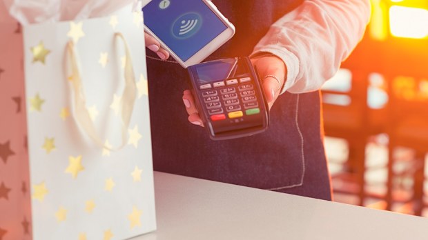 Christmas shopping paying with an iPhone