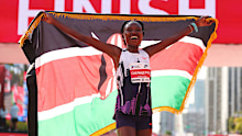 Ruth Chepngetich of Kenya celebrates after crossing the finish line to win the 2024 Chicago Marathon.